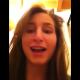 A girl video-records her facial expressions as she takes a shit while sitting on a toilet. Pooping sounds are clearly heard in the background.
